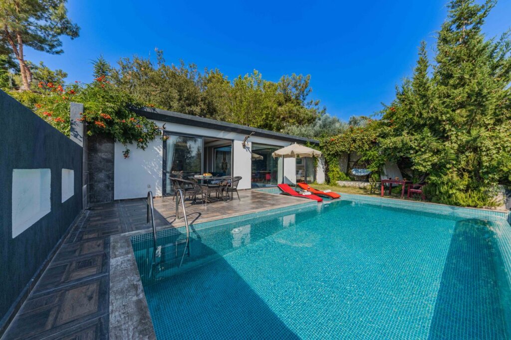 Experience serenity at a stylish villa with a private outdoor swimming pool.