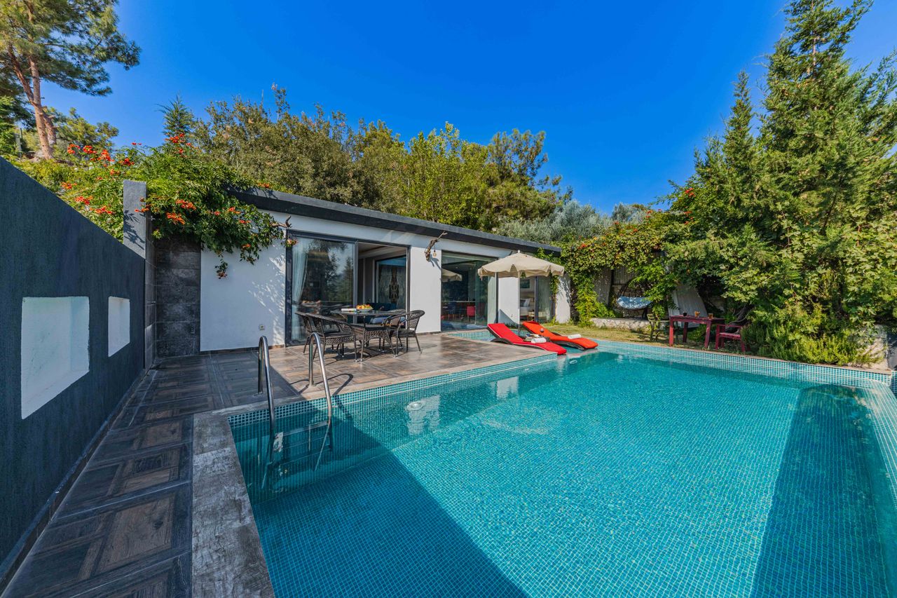 Experience serenity at a stylish villa with a private outdoor swimming pool.