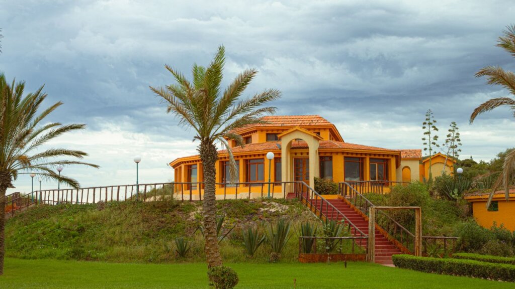 Stunning orange villa with lush greenery in Tabarka, Tunisia.
