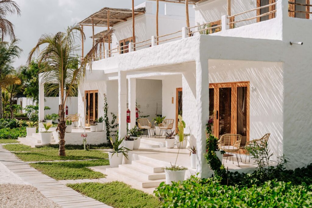 Bright modern villa in Jambiani, Tanzania with lush garden surroundings.